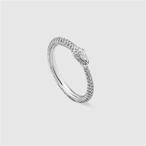 White gold and diamond Ouroboros ring .